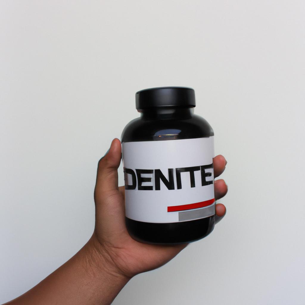 Person holding nutritional supplement bottle